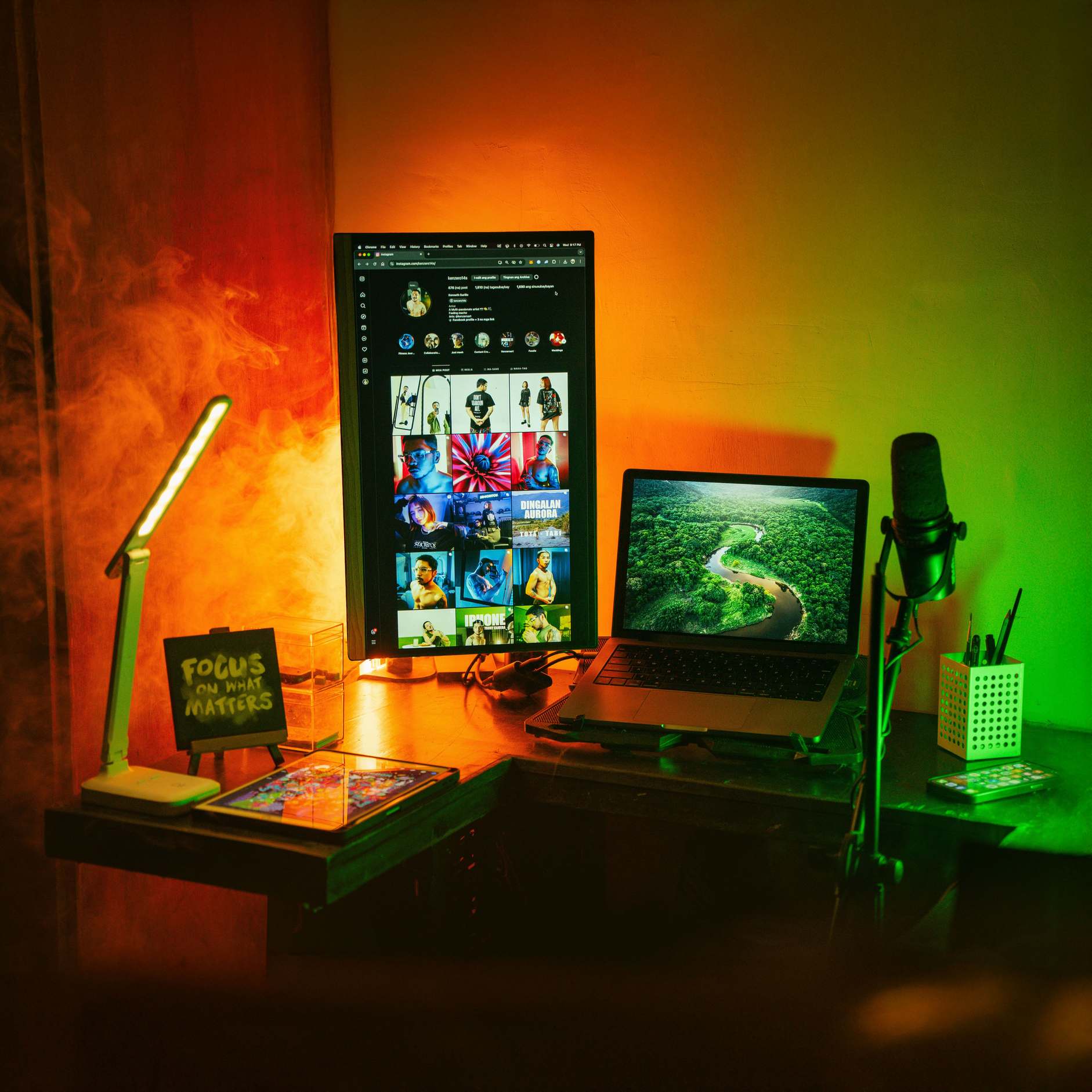 Developer workstation with monitors in an office setting, with colorful home office lighting